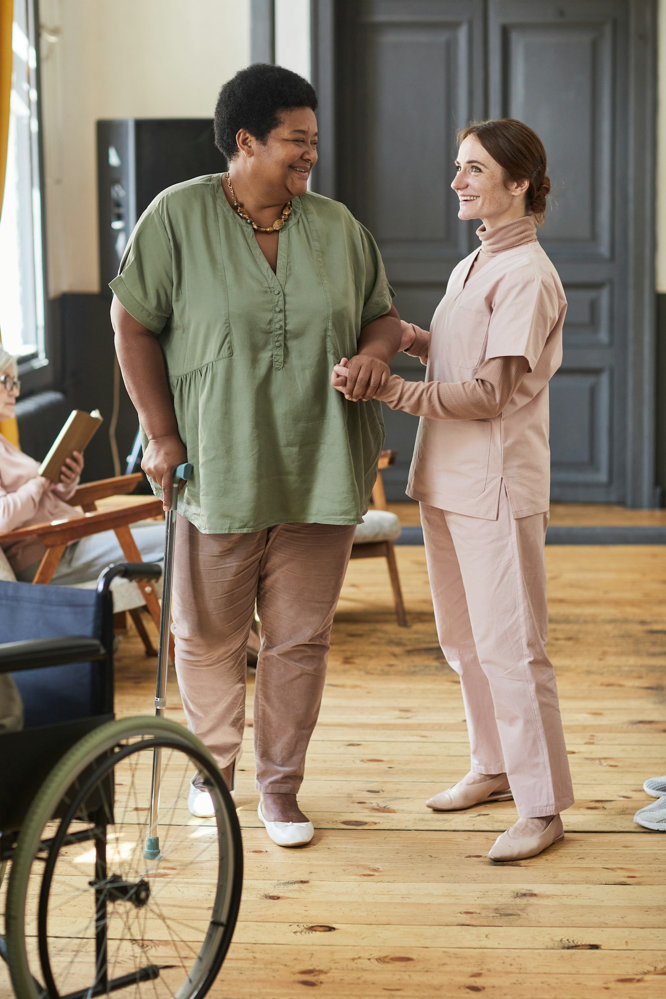 Caring Nurse Helping Senior Woman in Retirement Home